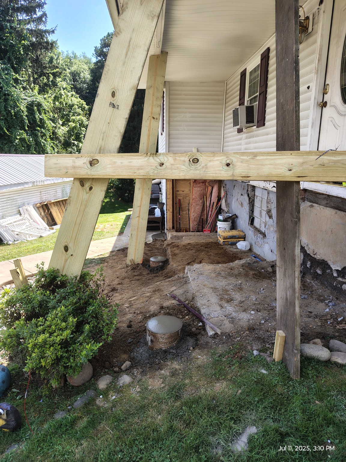 Roof temporarily supported with new posts and bracing after the porch structure was removed