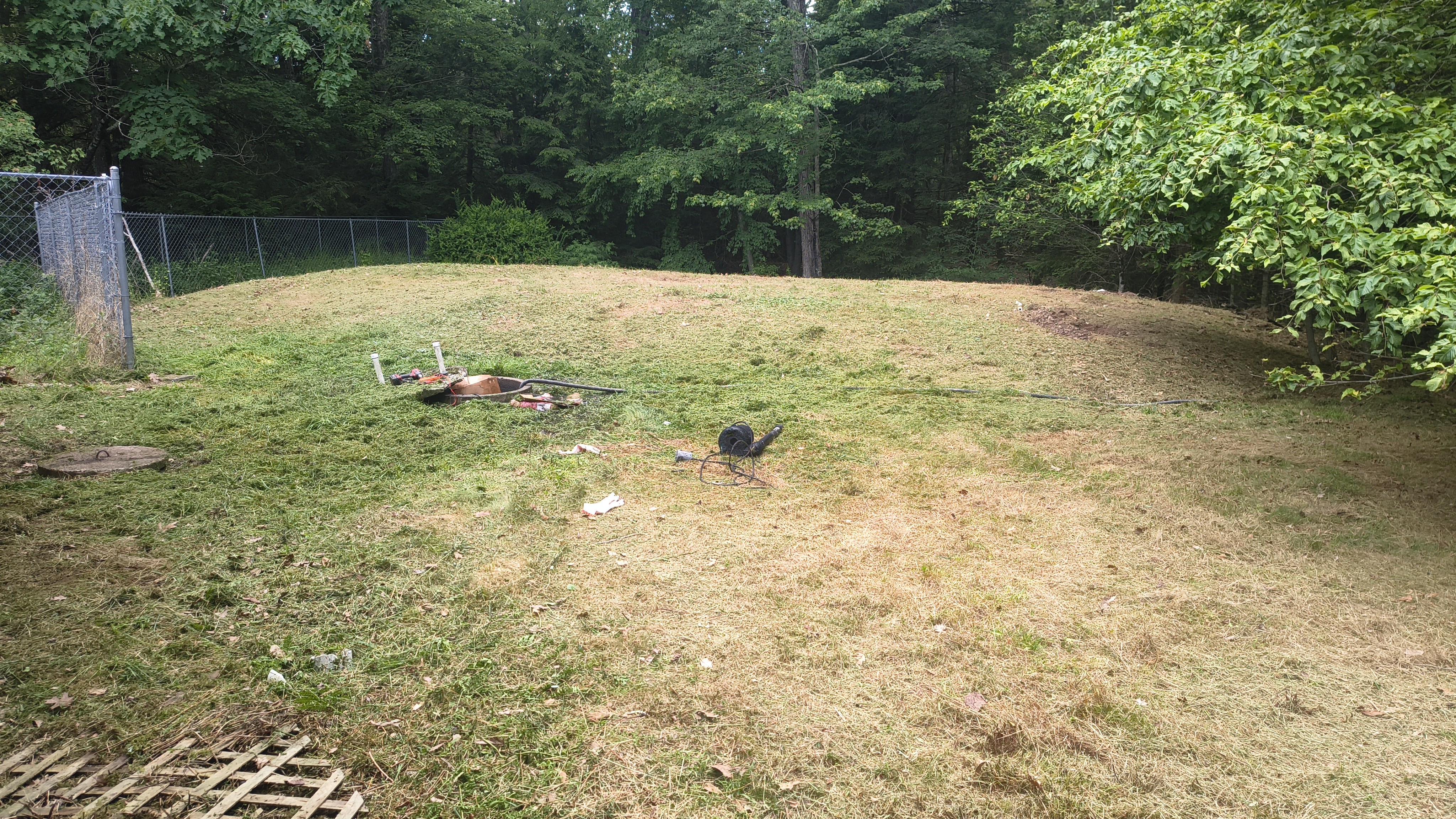 Sand mound and pump chamber area visible after vegetation was cut back in Waverly Pennsylvania